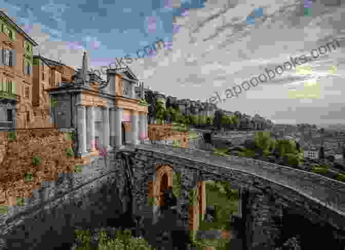 Intricate Stonework And Iron Gates Adorn The Entrance To Porta San Giacomo, An Iconic Gateway To Bergamo La Città Alta. Postcards: A Visual Escape Through Bergamo (La Citta Alta) Milan